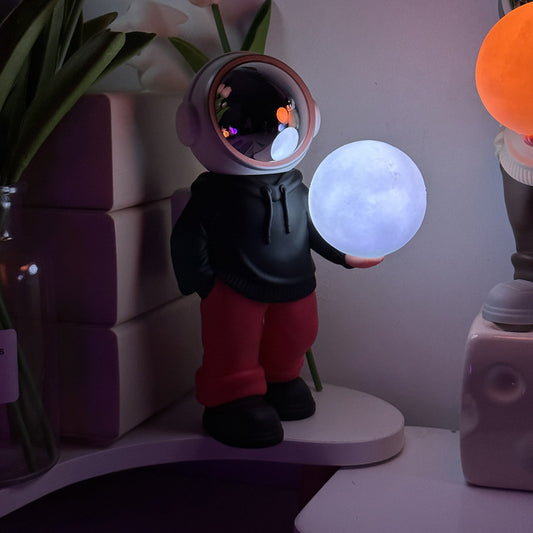 Holding the romantic moon (black top + red pants) Creative Astronaut Bluetooth Speaker with 3D Starry Sky Lighting, Portable Wireless Moon Lamp Speaker - Perfect Gift for Space Enthusiasts